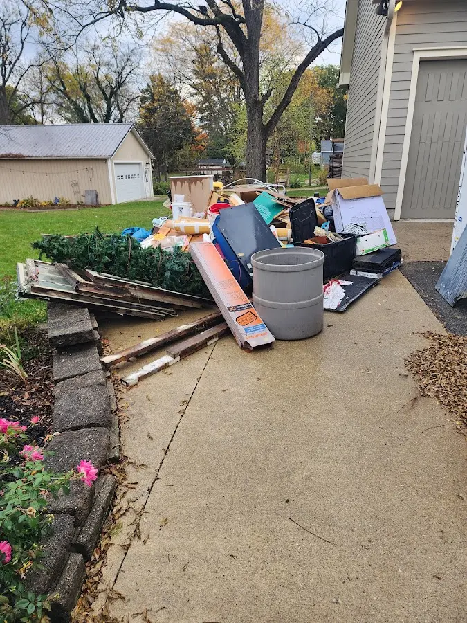 Dumpster being loaded with debris for 3 Yard Dumpster Rental in Shively